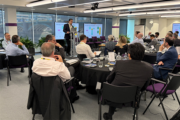 Man presenting in front of an audience at the Upper 6GHz workshop